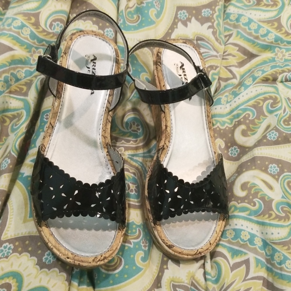 Wedged kids high heal shoes. Has a velcro strap.